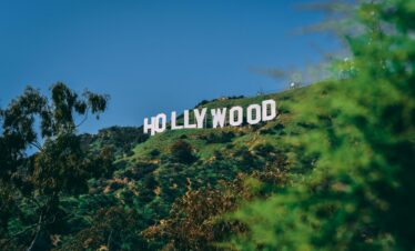 A scenic view of the famous Hollywood sign on a sunny day in Los Angeles.