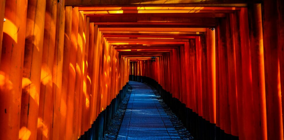Explore the stunning orange torii gates of Fushimi Inari Taisha in Kyoto, Japan.